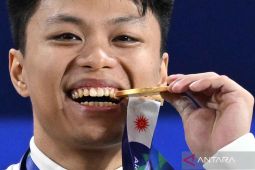 Rahmat Guncang Dunia Angkat Besi Rekor Pecah