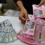 Rupiah Terguncang Investor Menanti Keputusan BI